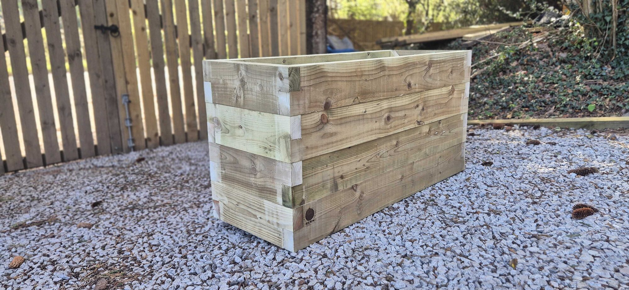 Planter detail showing the stacked-course construction and interlocking corners