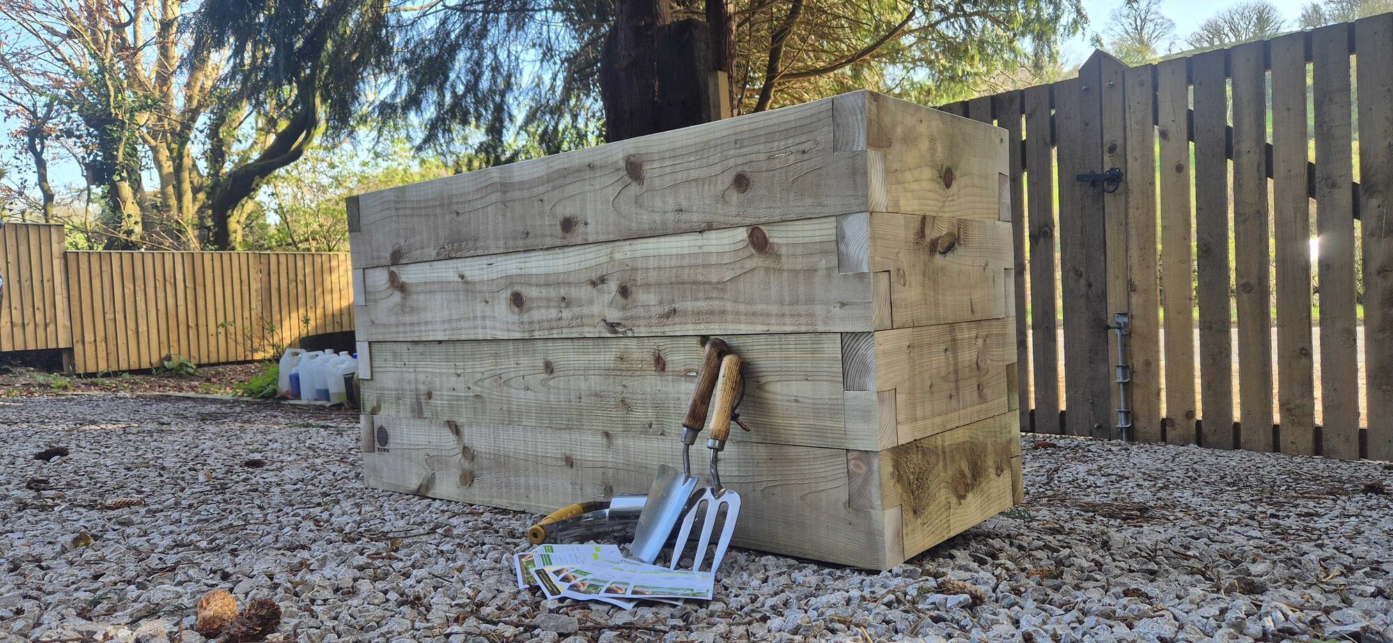 Gwern planter in a North Wales garden, three-quarter view on gravel
