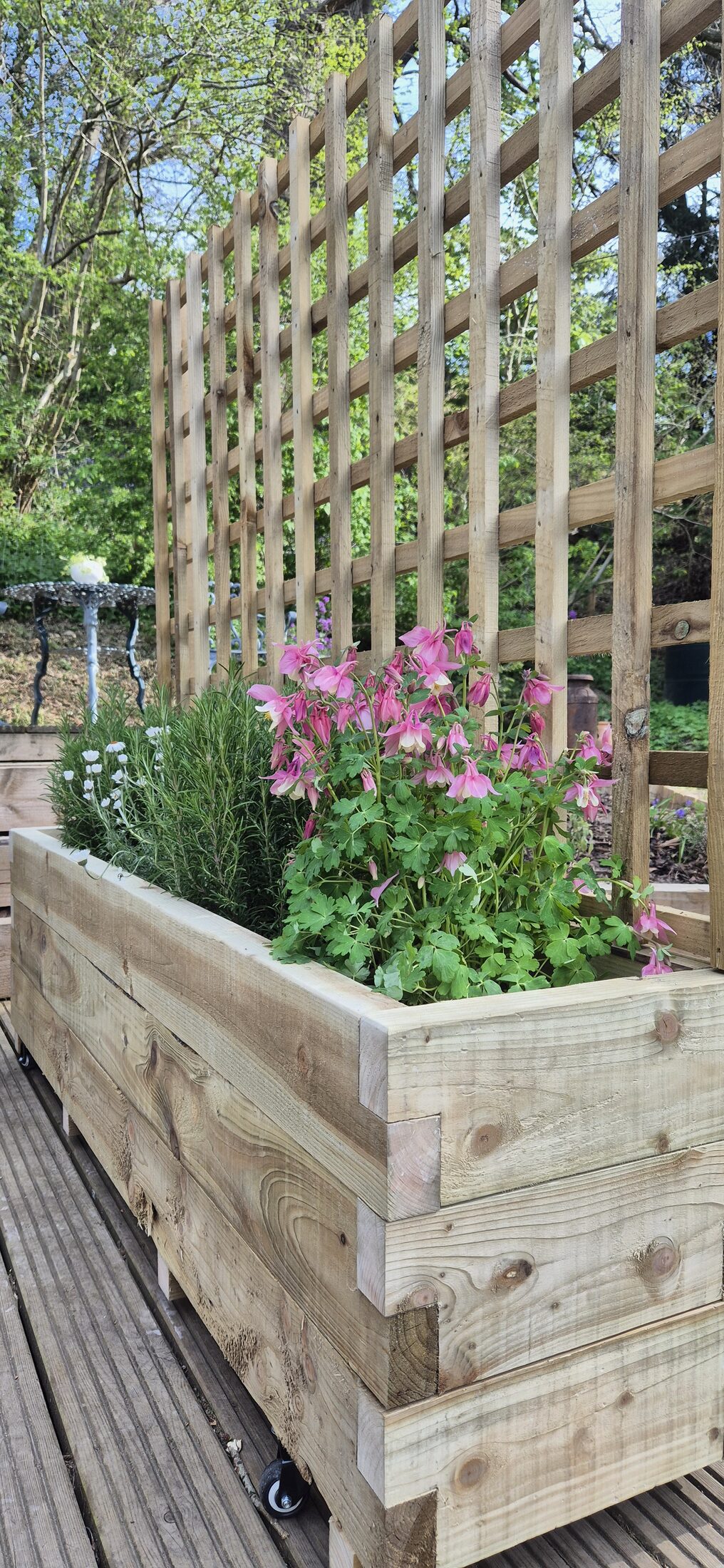 HEWN handmade trellis planter on a North Wales garden deck, with garden chairs